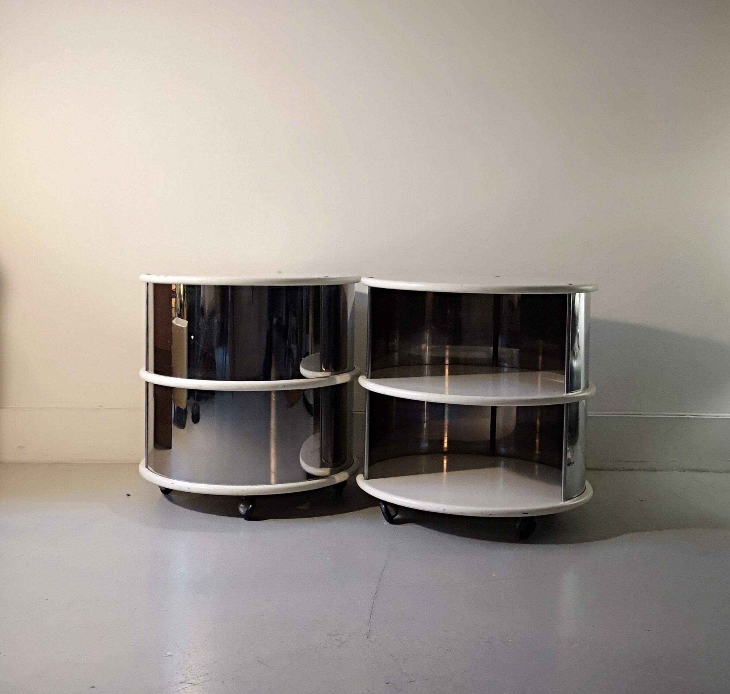 Pair of mirrored space age cylindrical bedside tables, 1960