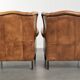 Set of two light cowhide wingback armchairs with a timeless English look