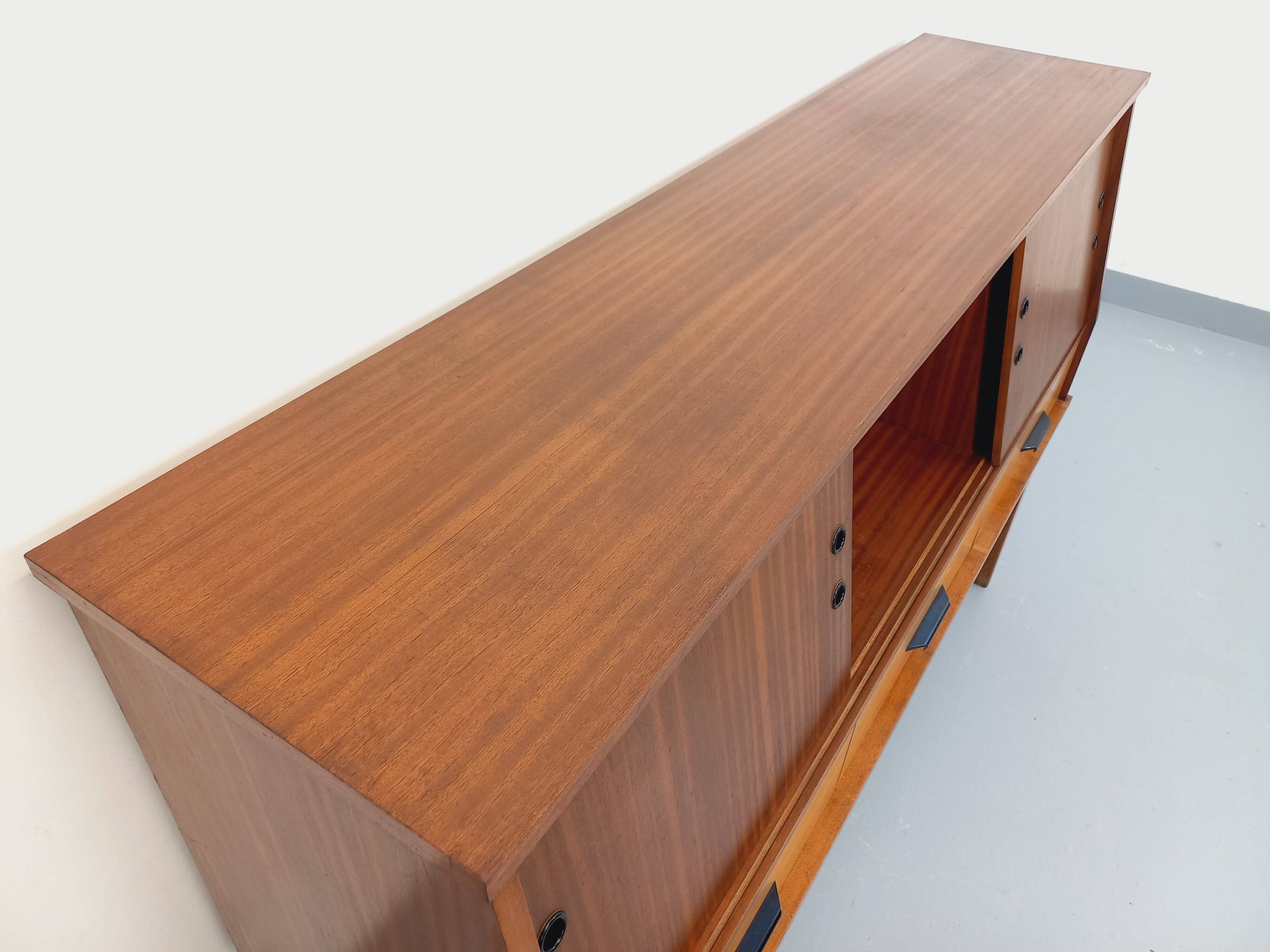 Vintage wooden enfilade in teak style from the 1960s.