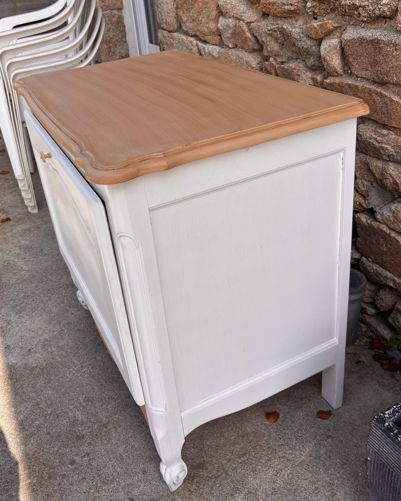 Renovated vintage furniture in raw wood and white.
