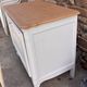 Renovated vintage furniture in raw wood and white.