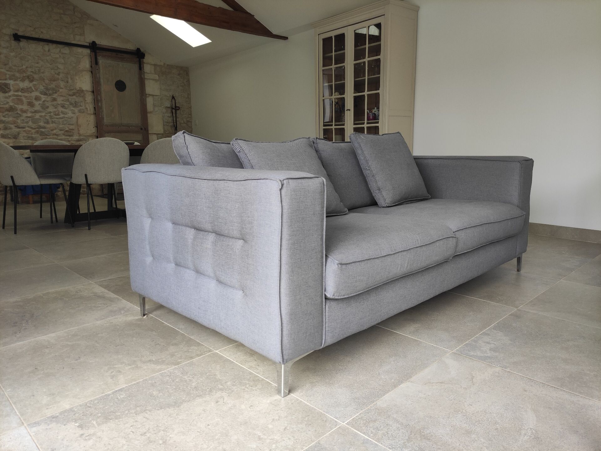 Three-seater grey mottled fabric sofa