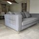 Three-seater grey mottled fabric sofa