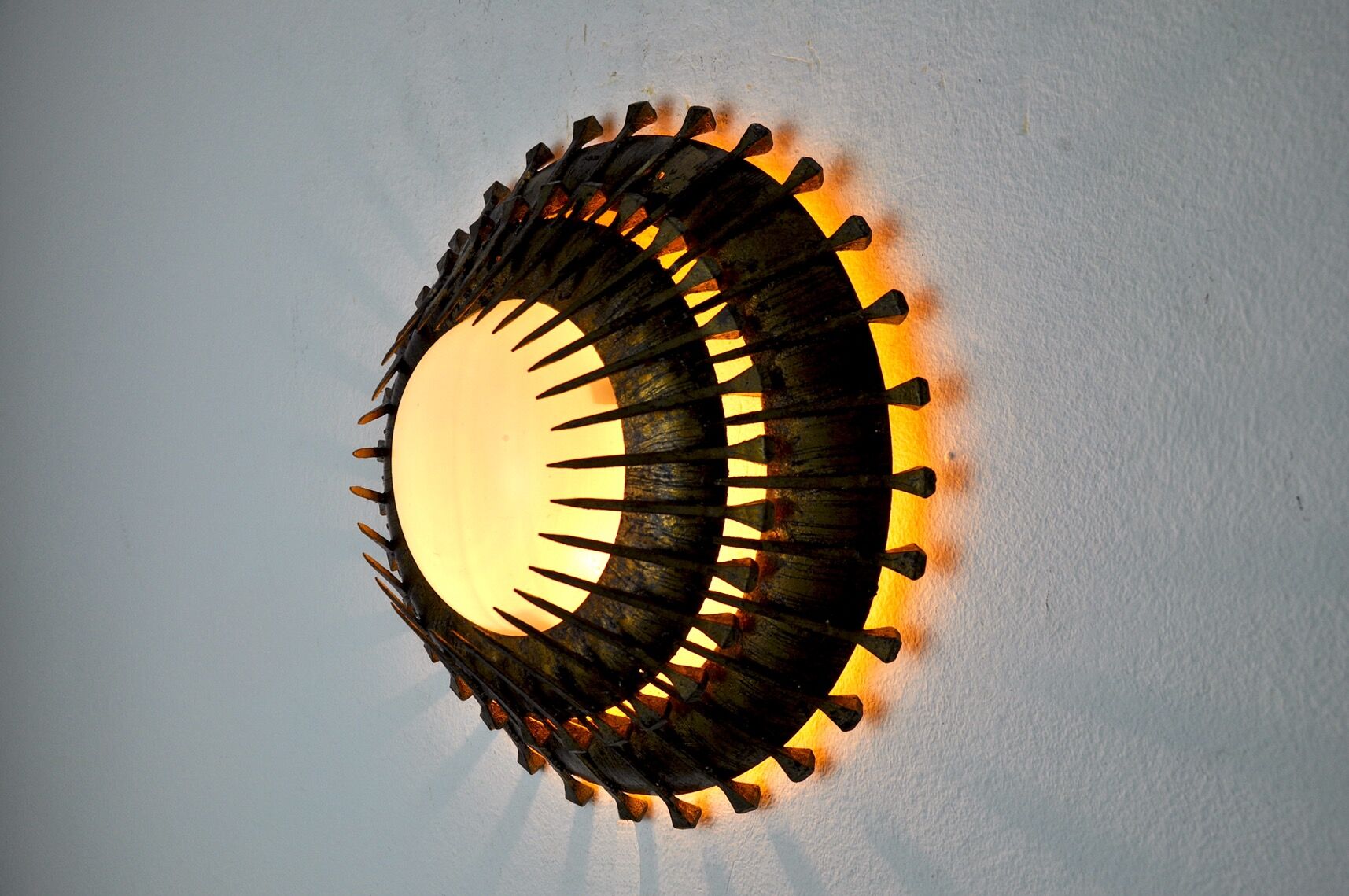 Midcentury brutalist sun wall lamp, metal and gold leaf, Italy