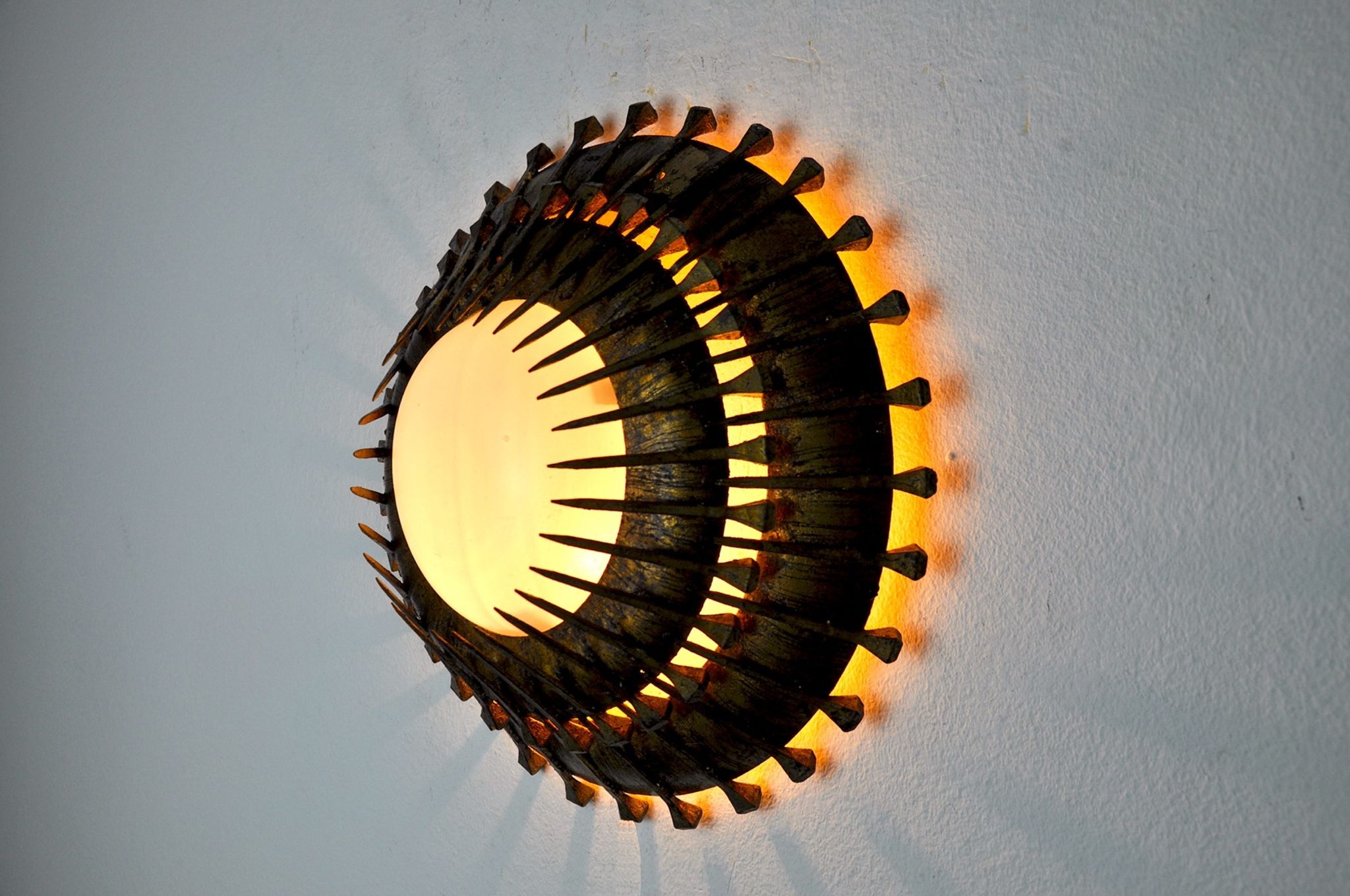 Midcentury brutalist sun wall lamp, metal and gold leaf, Italy