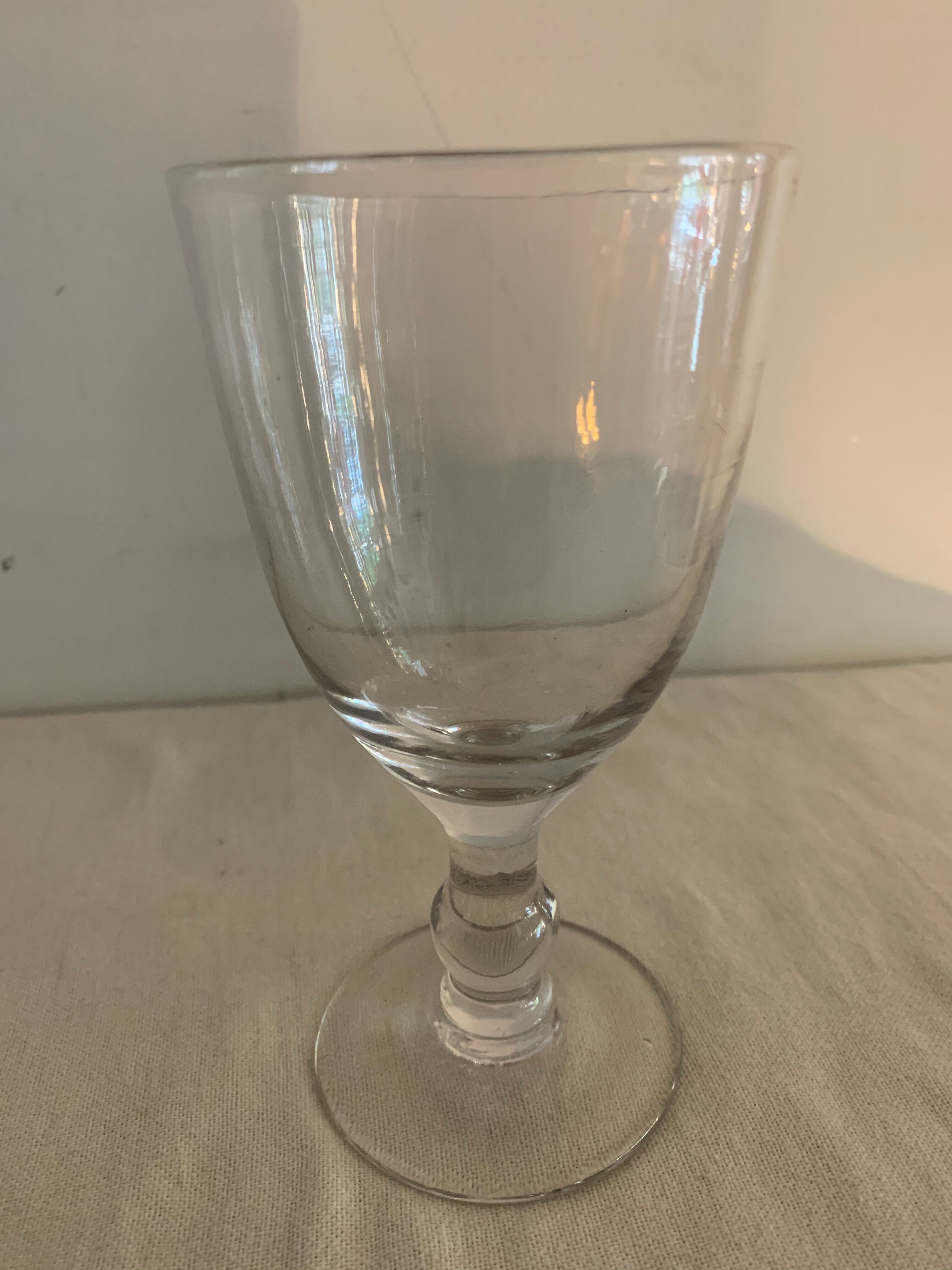 8 old blown and different foot wine glasses