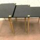 Pull out tables in brass and black glass XX century