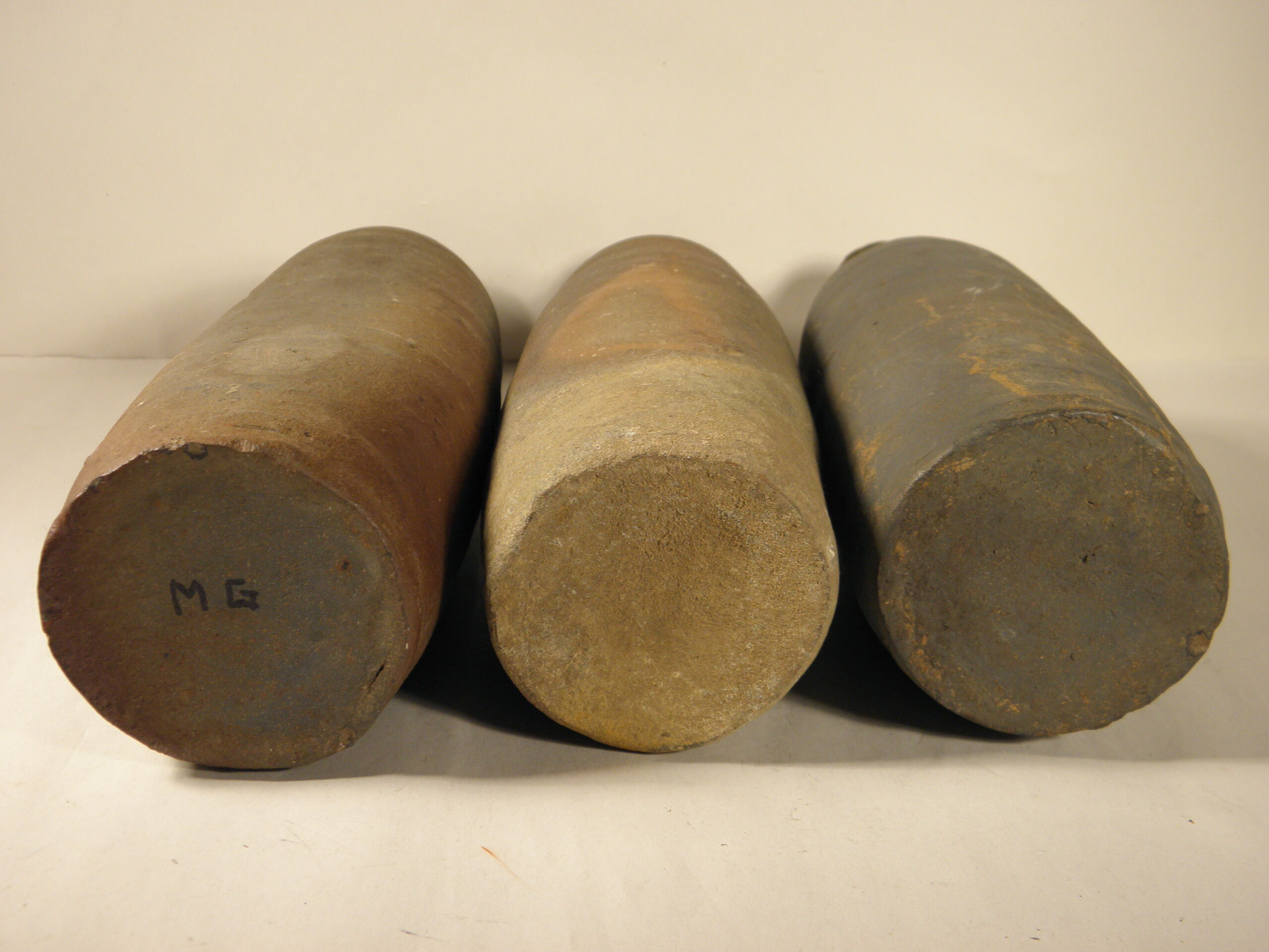 Three old sandstone bottles