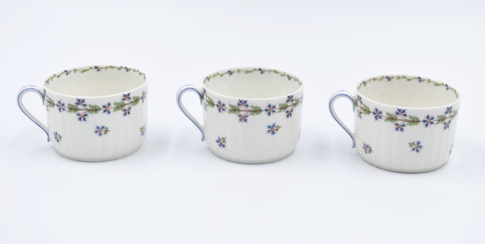 Three cups and under porcelain tea cups from Limoges Haviland barbed-wire décor