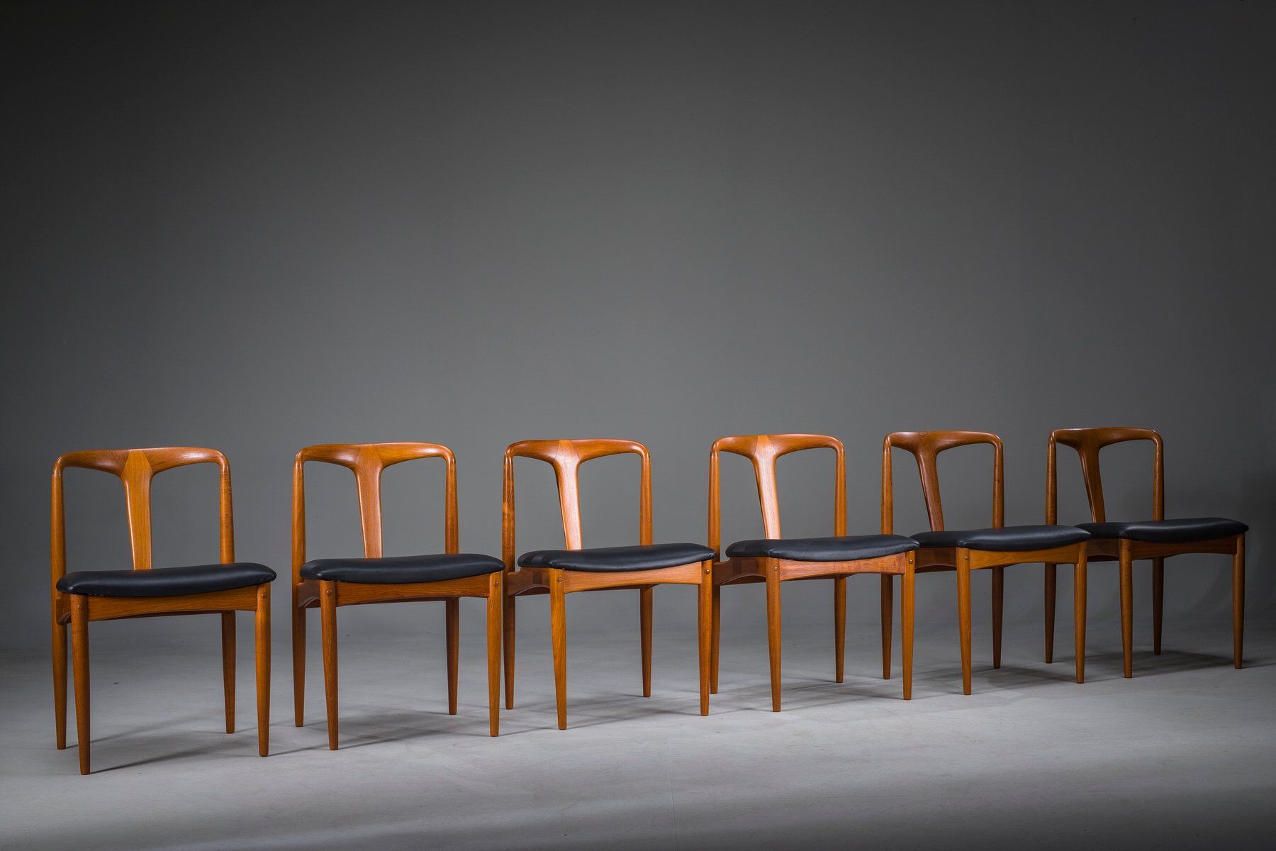 Juliane dining chairs in teak and black leather by Johannes Andersen for Uldum Møbelfabrik, Denmark, 1960s, set of 6