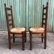 Duo of vintage rustic straw straw chairs in oak.
