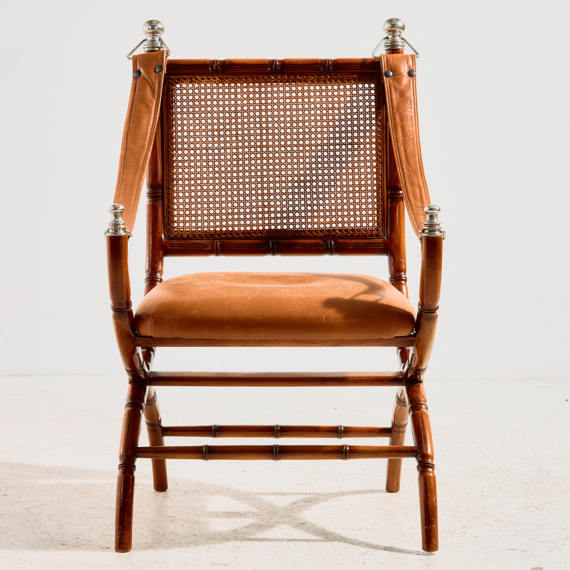 Walnut armchair with bamboo design