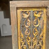 Rectangular Indonesian construction element with blue and yellow plant in carved wood