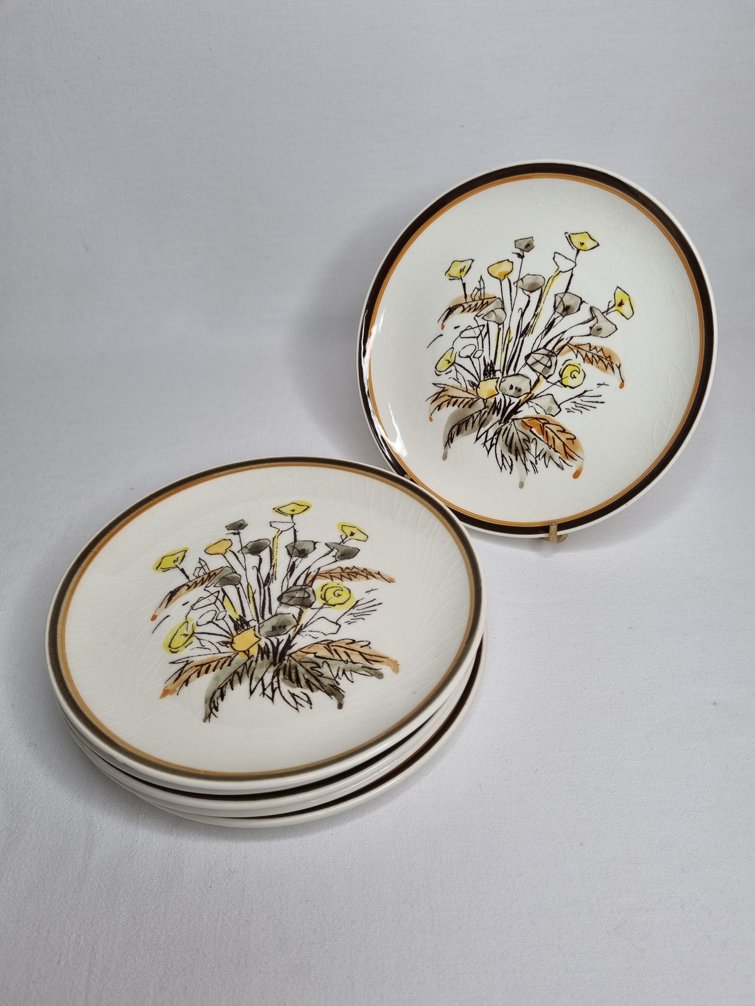 Six vintage dessert plates decorated with flowers from the Gien earthenware factory