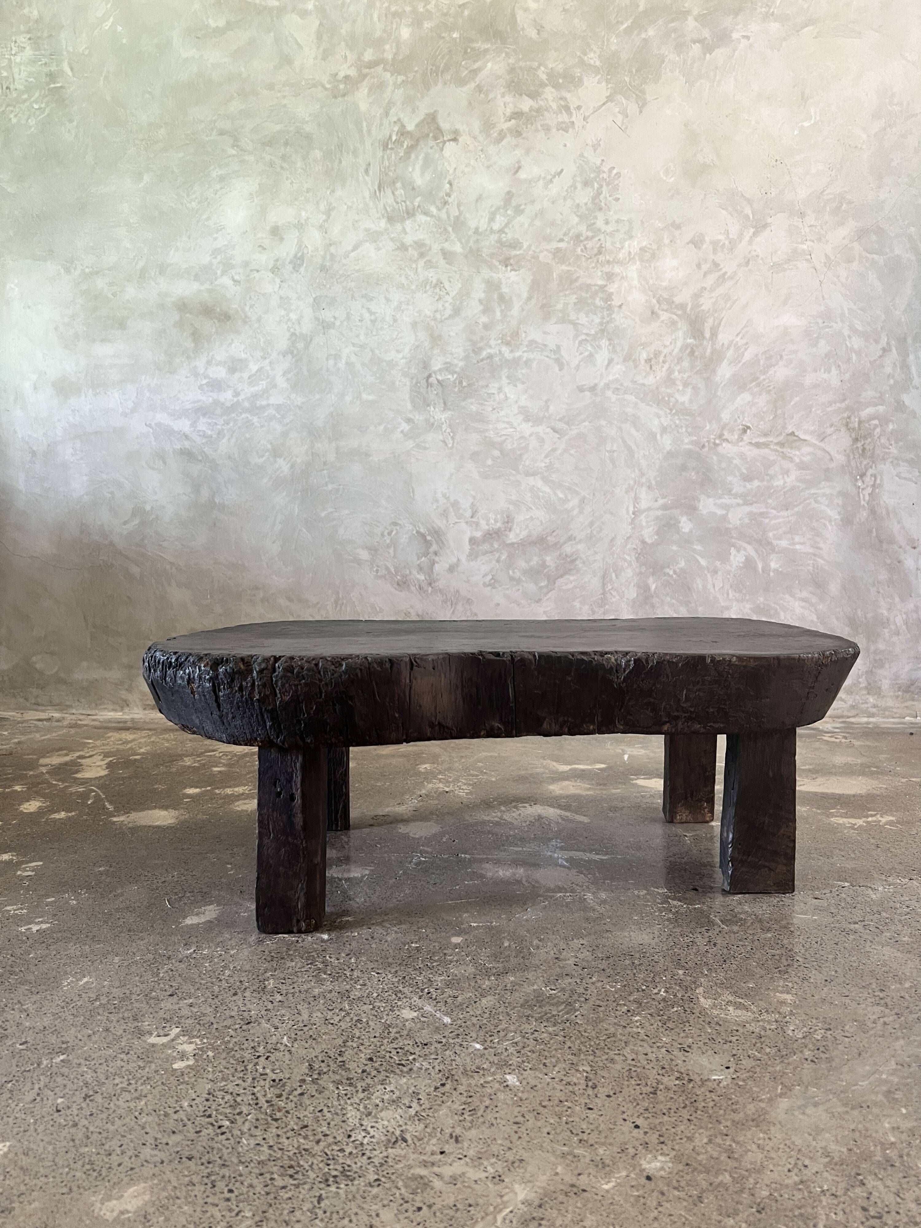 Small old Asian wooden coffee table in Japanese style, kidney-shaped top