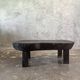 Small old Asian wooden coffee table in Japanese style, kidney-shaped top