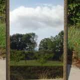 Mirror with black and gold frame, embossed vine leaves
