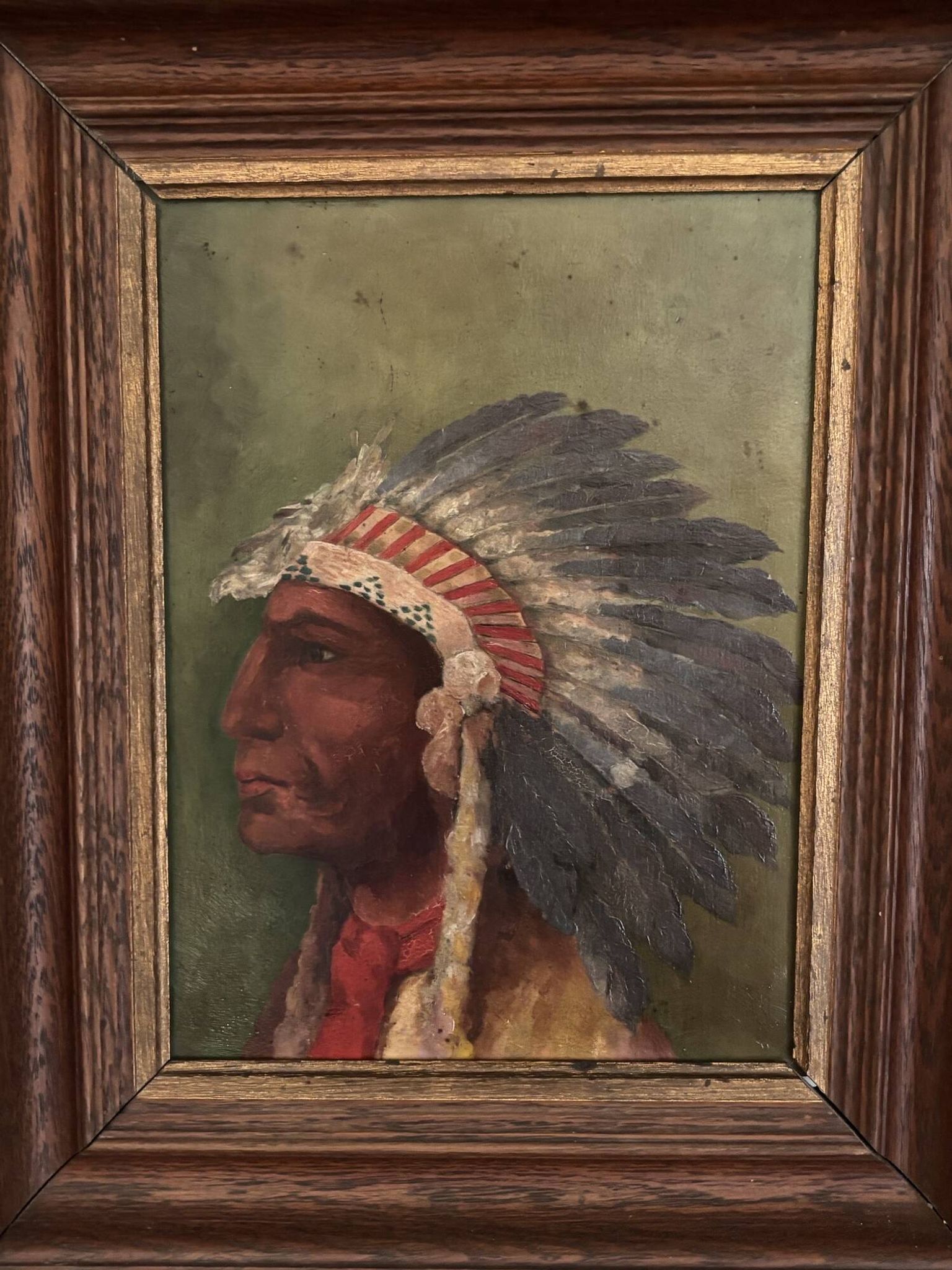Old oil painting on panel of a Native American chief from the 19th century Wild West.