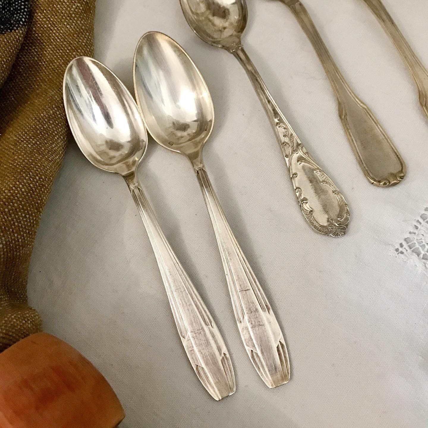 6 mismatched silver spoons