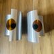 Pair of Space Age wall lights in brushed metal with a copper-orange interior.
