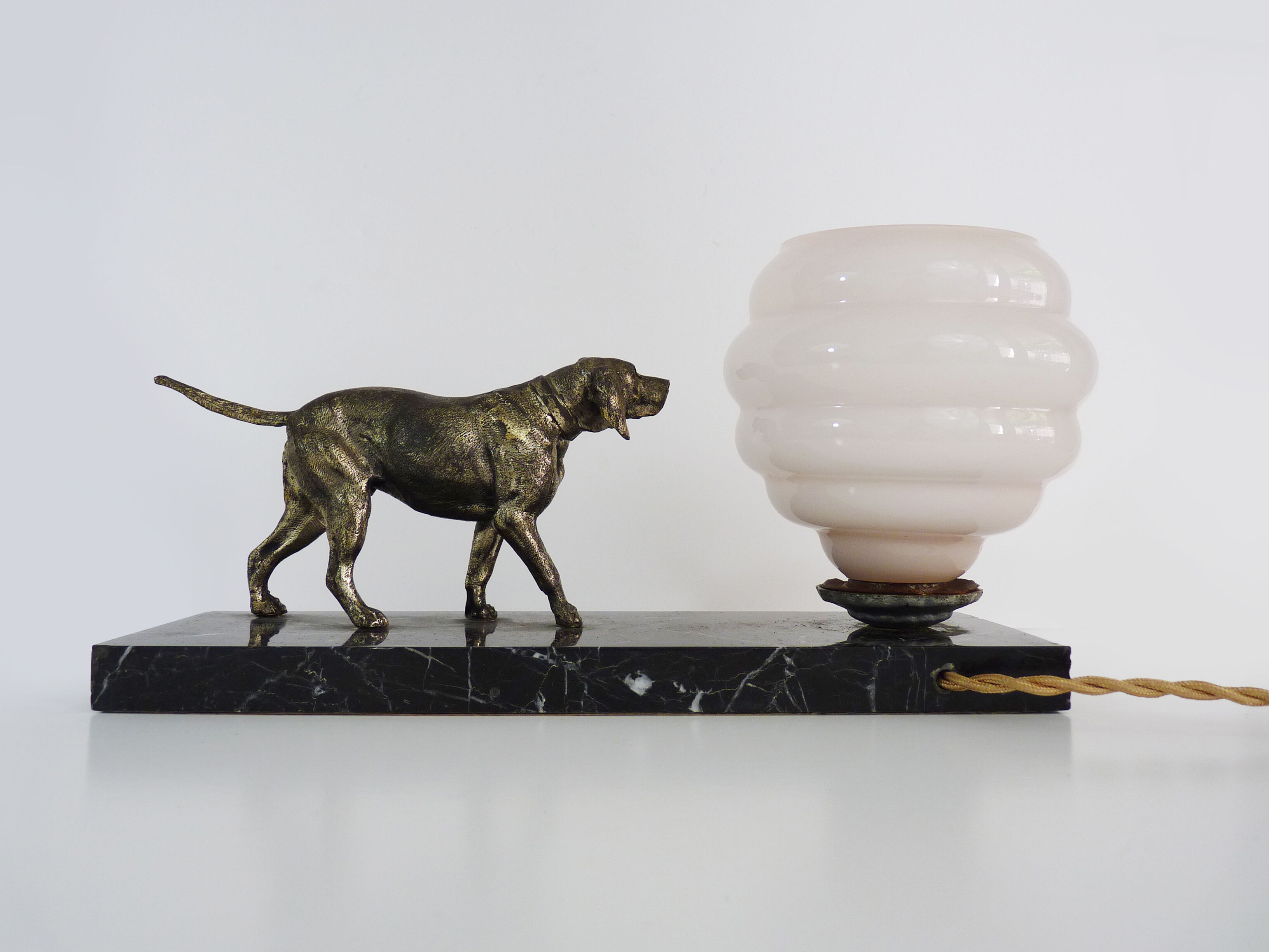 Lamp, Art Deco night light, dog on black marble base, pink globe. Year 30