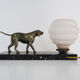Lamp, Art Deco night light, dog on black marble base, pink globe. Year 30
