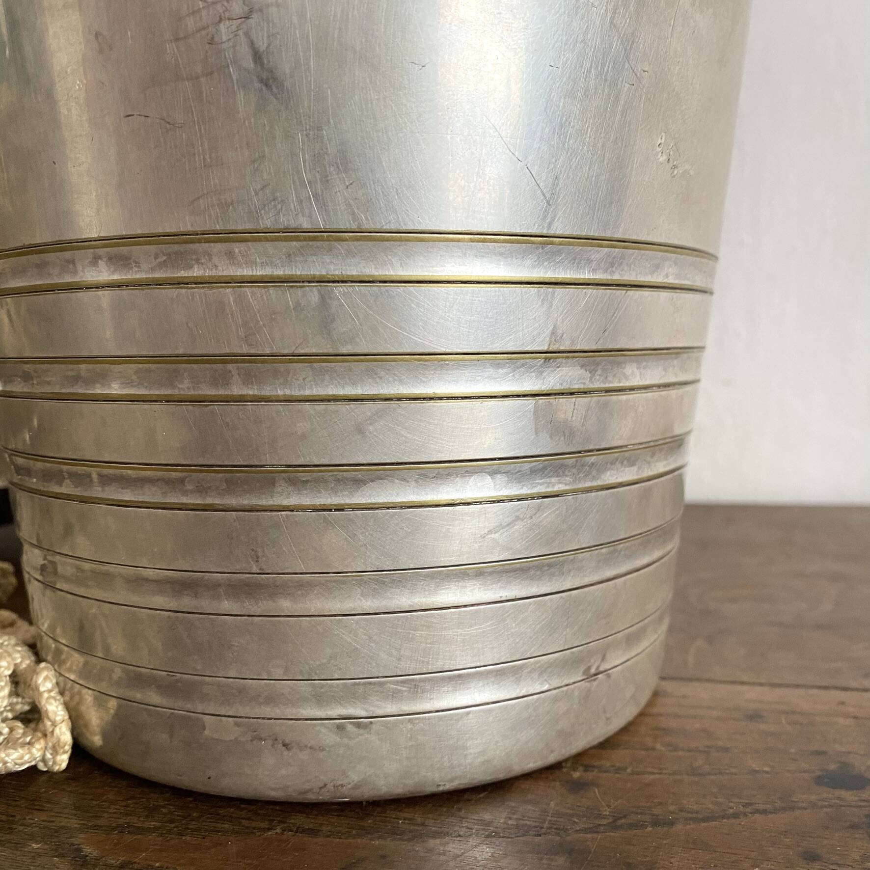 Antique champagne bucket with shell handles.
