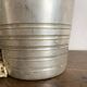 Antique champagne bucket with shell handles.