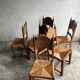 Set of 6 sculpted oak chairs with straw seats – 1950s