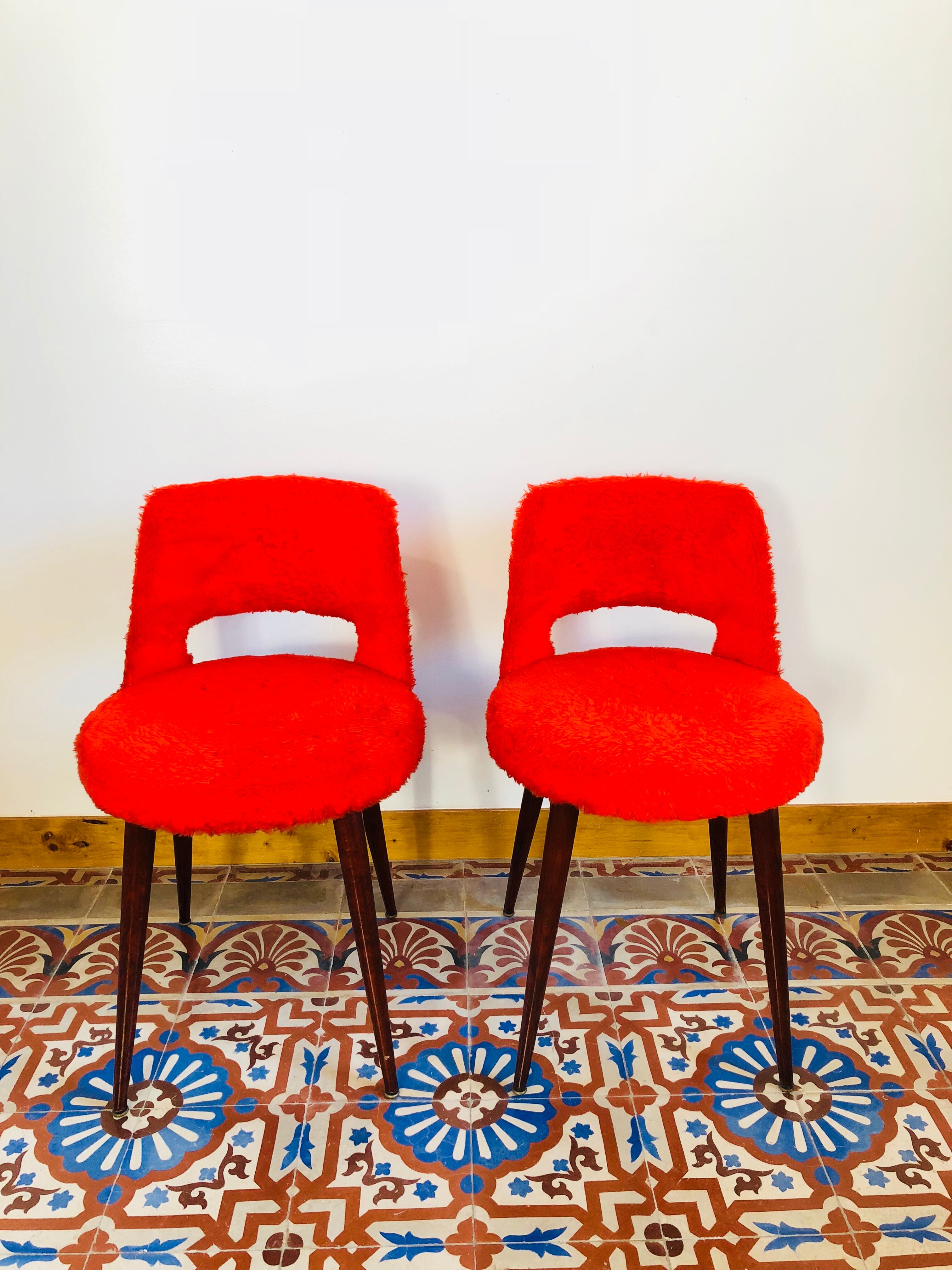 Pair of chairs red rug