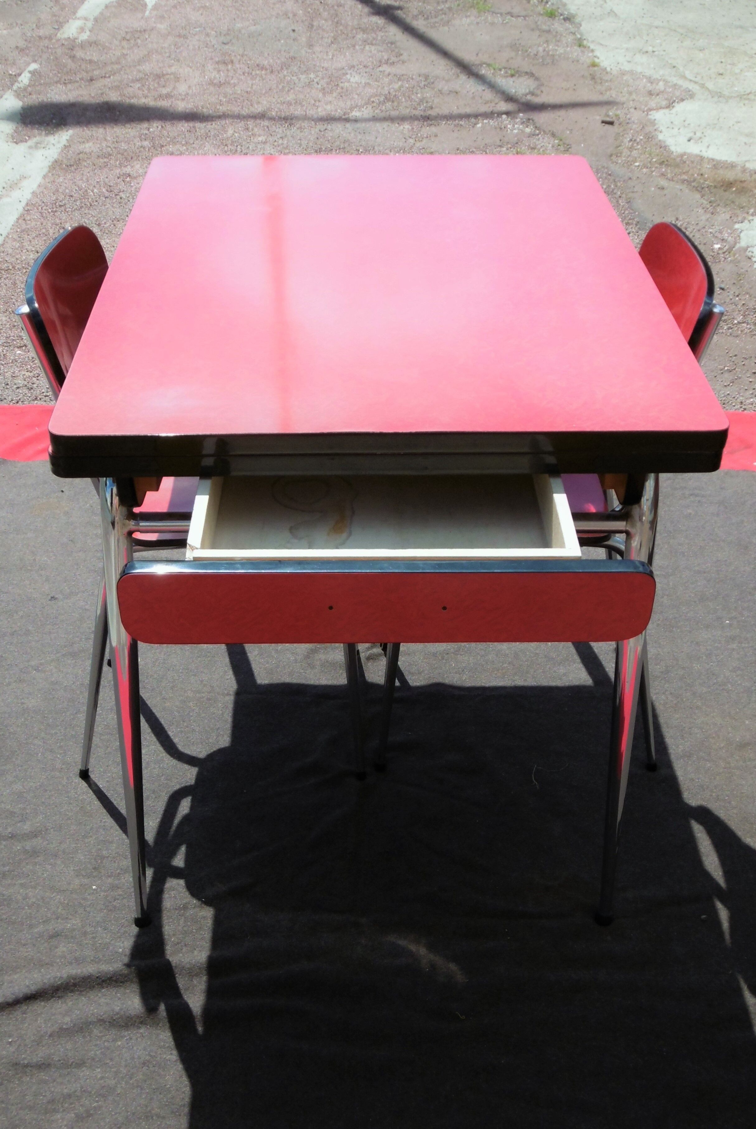 Red formica table and two chairs