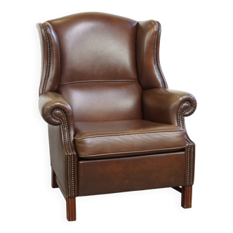 Grand fauteuil à oreilles en cuir de vache marron foncé
