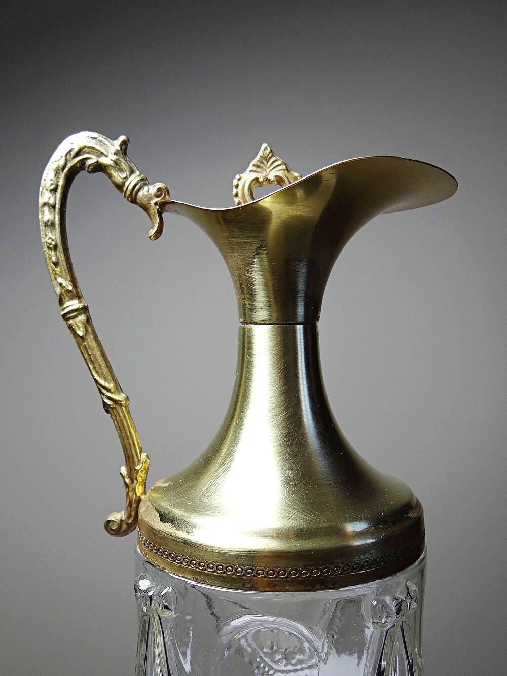 Vintage decorative jug in moulded glass and gilded brass, Italy circa 1980.