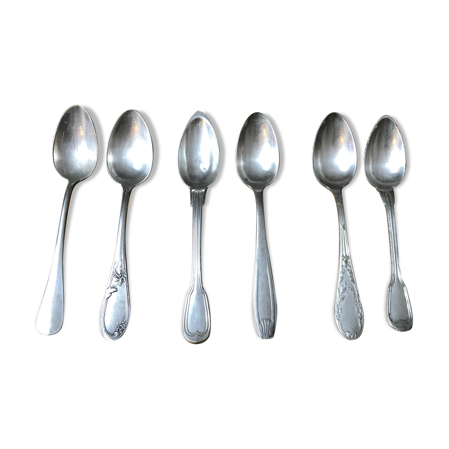 6 small mismatched silver metal spoons