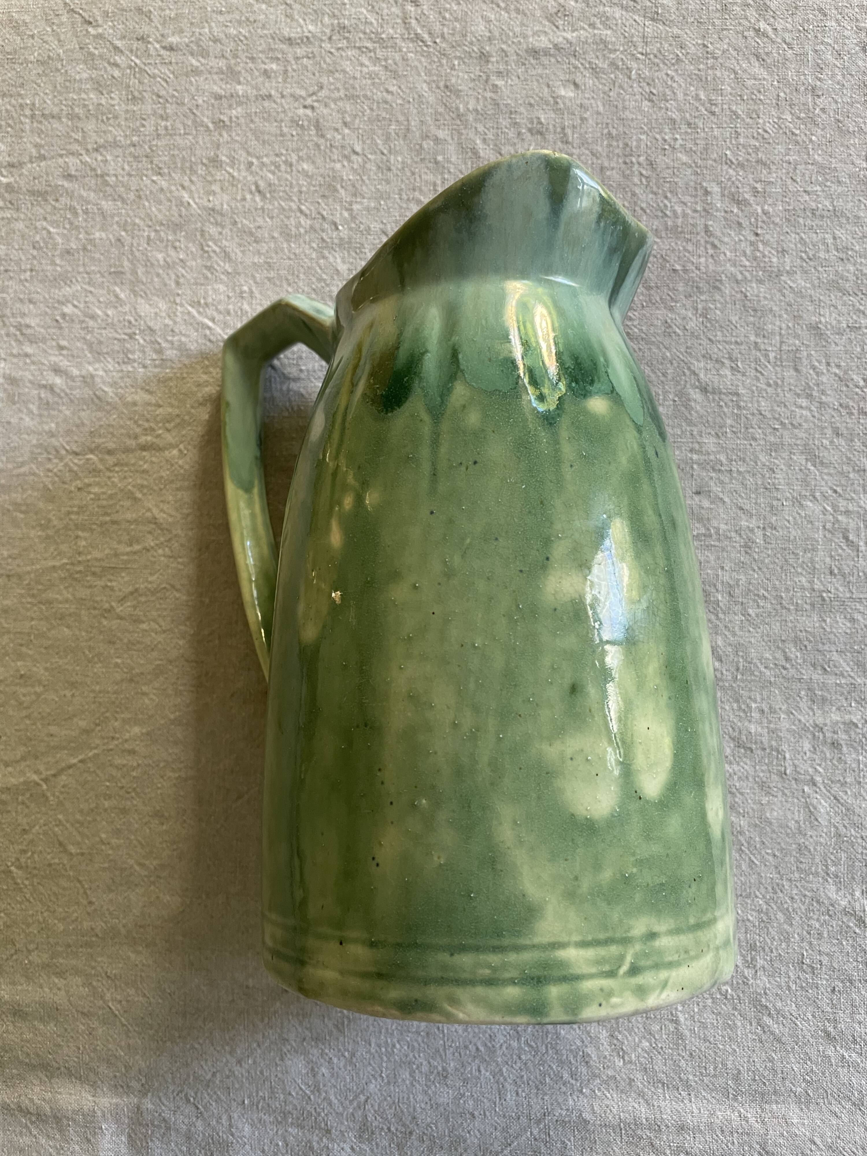 Turquoise green enamelled ceramic pitcher