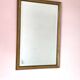 Rectangular gold mirror with bevelled glass.