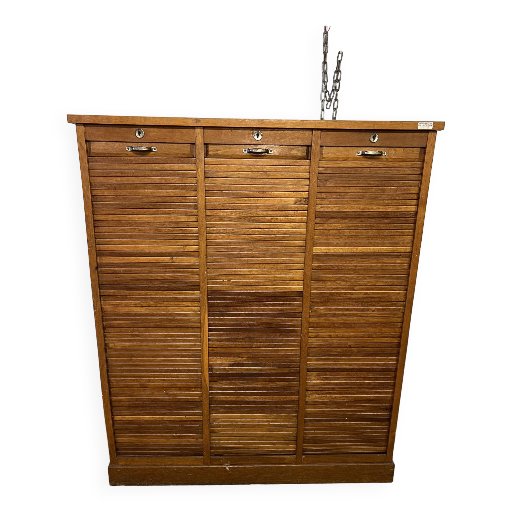 Old filing cabinet with triple curtains