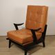 Paire de fauteuils vintage années 50 en bois noir et cuir caramel