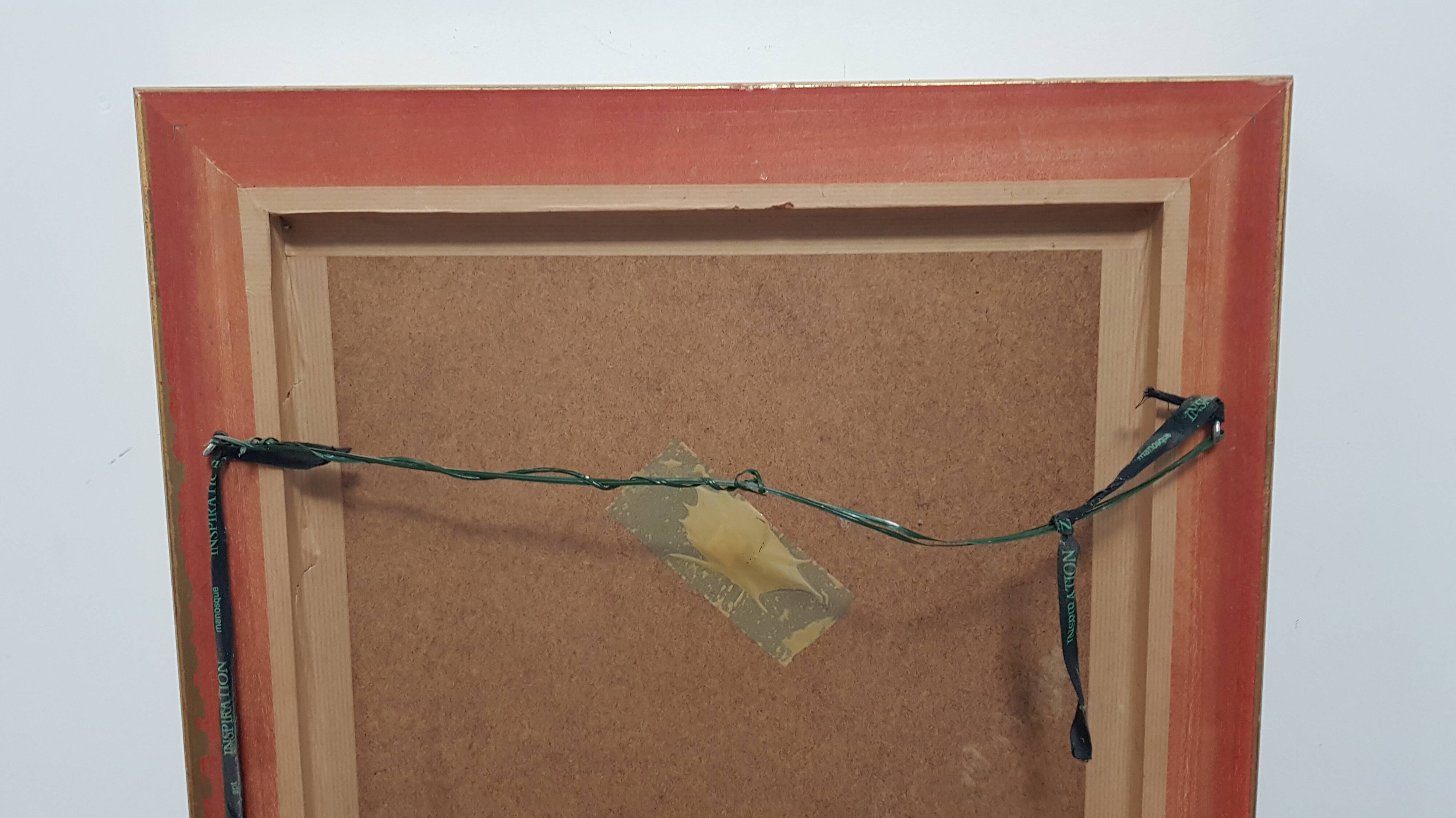 Mirror in gilded stucco wood and beveled glass