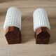 Philips wall sconces in wood and white opal.