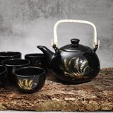 Japanese tea service, teapot and 6 cups, black, gold pattern.