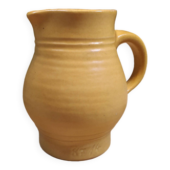 Small pastel yellow stoneware carafe