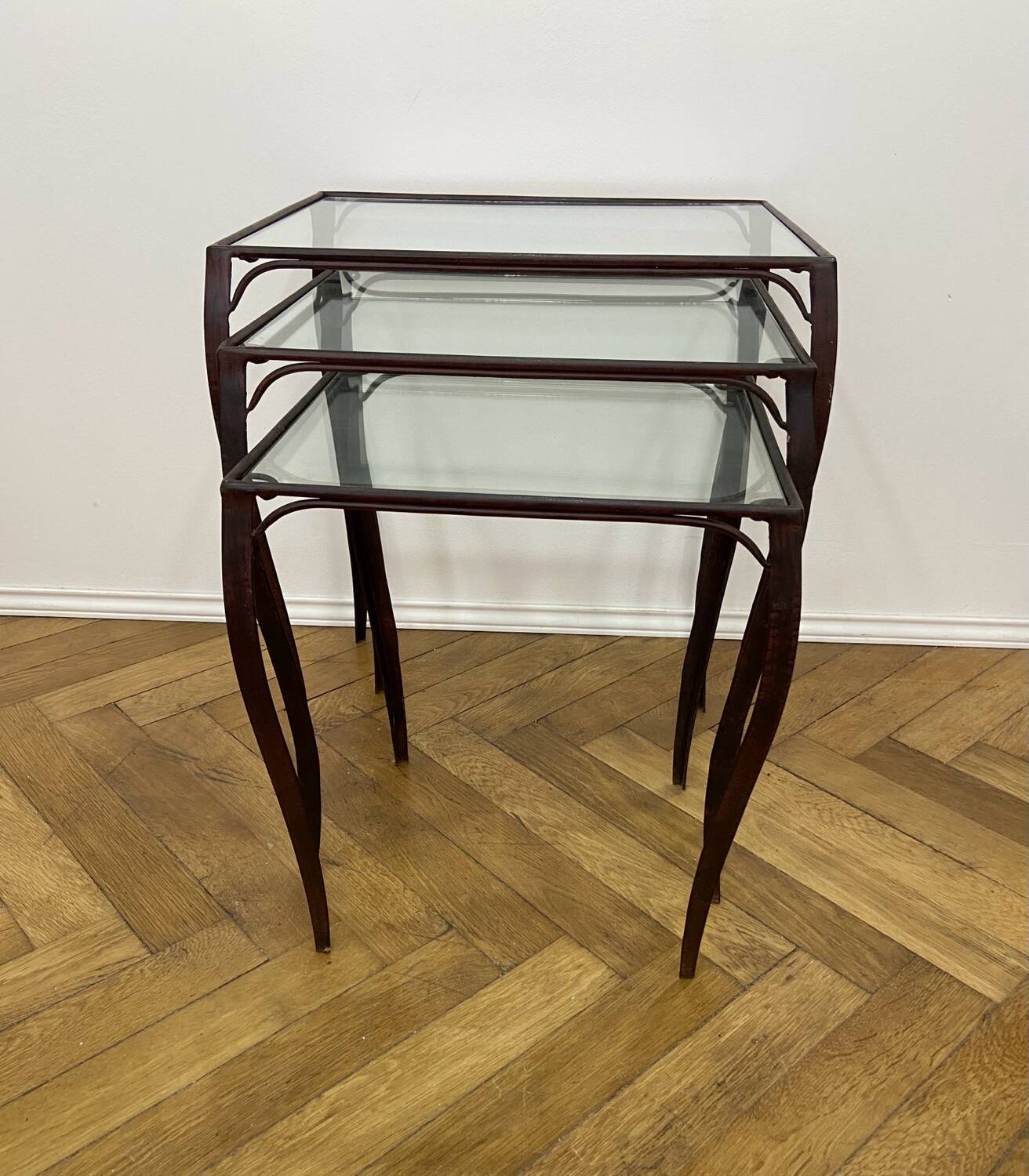 Nesting tables in wrought iron and glass