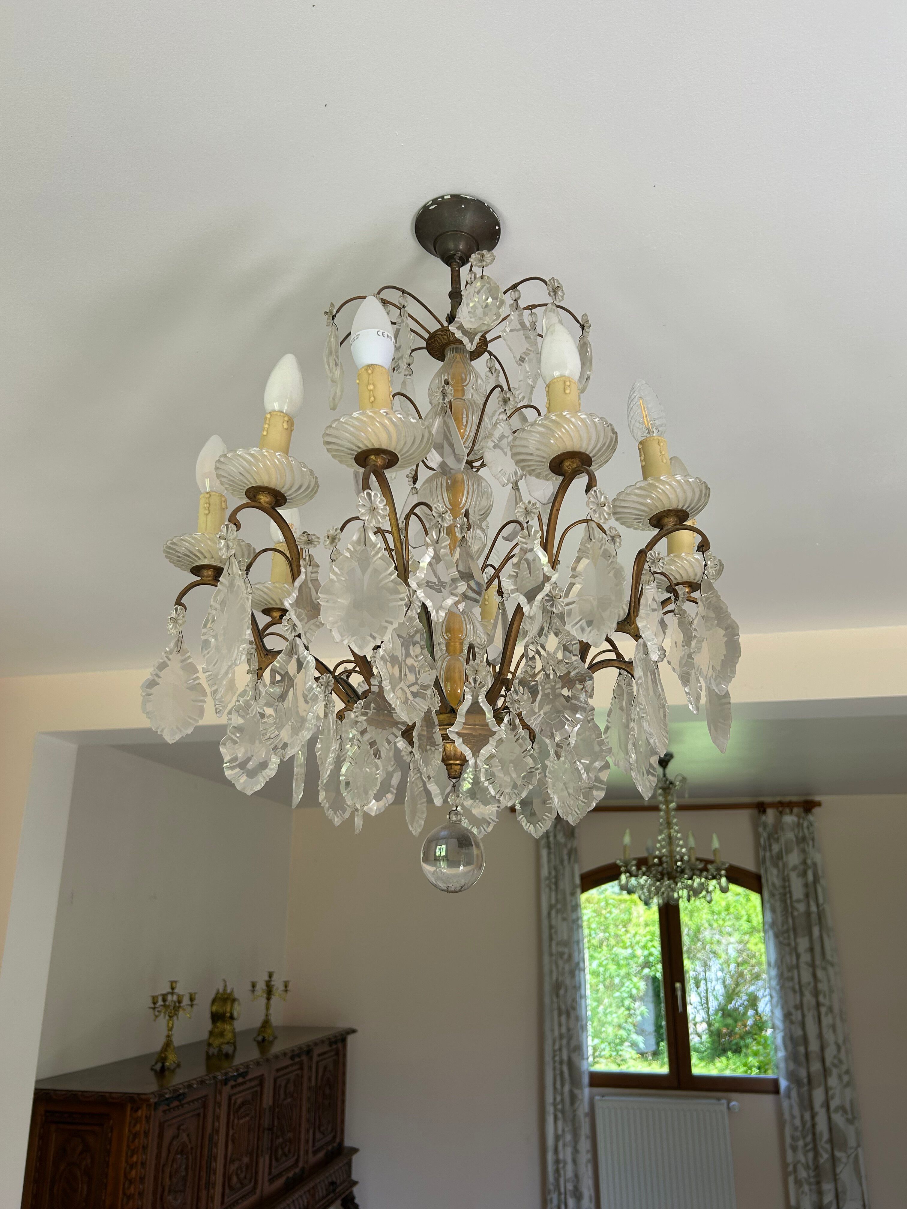 Lustre with 10 arms of light, antique with crystal pendants.