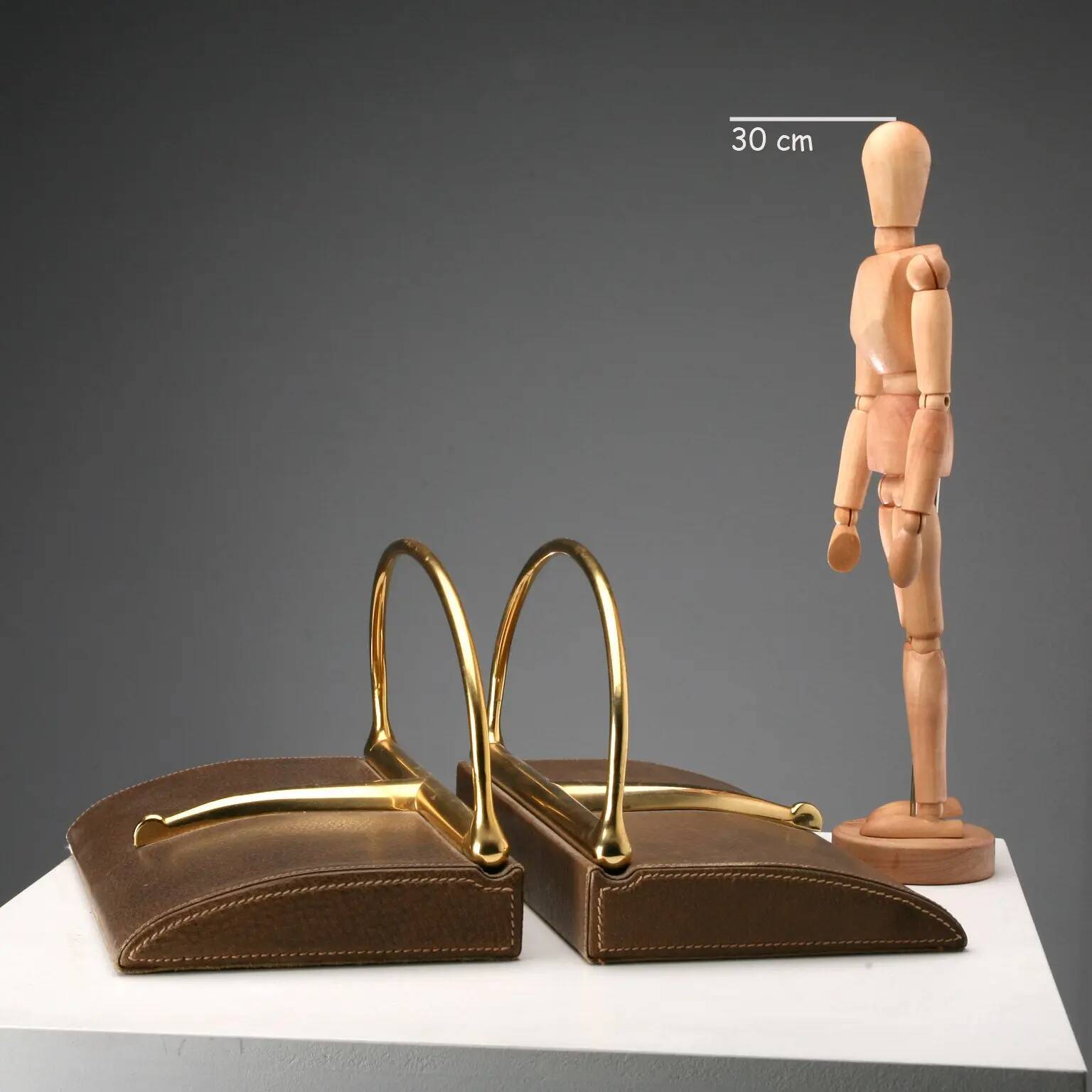 Vintage Gucci bookends in leather and brass, Italy, 1970s.