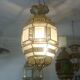 Traditional Moroccan hanging lantern in glass and metal.