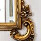 Large Italian mirror in carved wood, traditional gilding, 1980s.