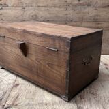 Teak chest from Burma with carved rosettes.