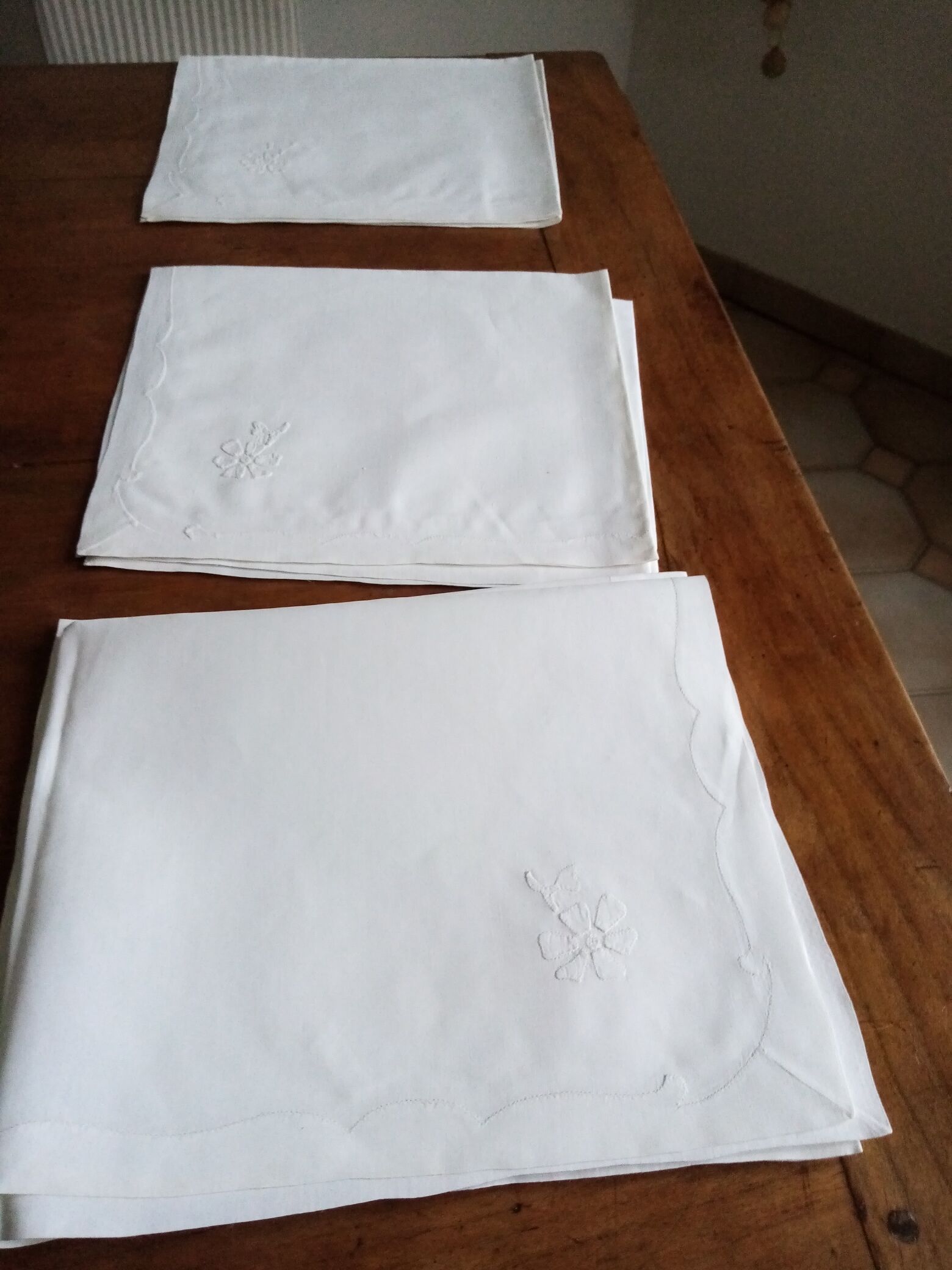 Antique white tablecloth embroidered with flowers and matching napkins