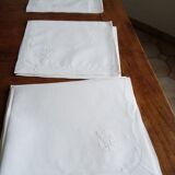 Antique white tablecloth embroidered with flowers and matching napkins